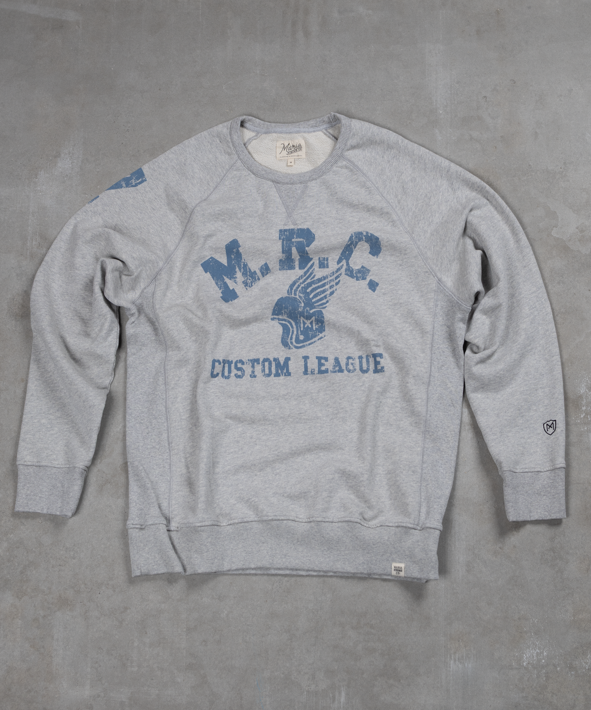 Gray sweatshirt with blue text and logo on a gray background